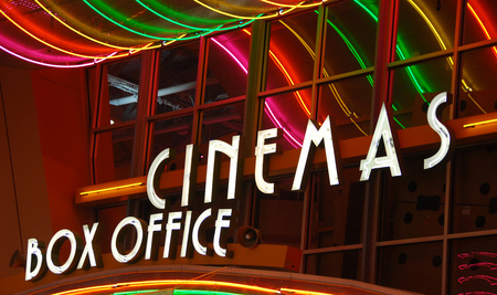 movie theater sign that says Cinemas and Box Office in neon colored lights ... purchased from icholakov - Fotolia.com 